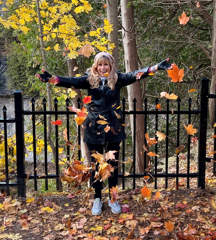 Julie in fall leaves